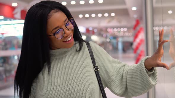 Smiling African American Girl While Shopping in the Supermarket