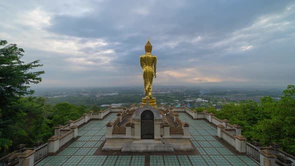 Time lapse of golden buddha pagoda stupa. Wat Phrathat Khao Noi Temple Park, Nan, Thailand