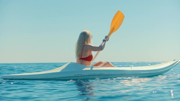 Paddling Canoe Adventure. Tourist Woman Spending Day Kayaking On Sea. Active Woman Having Fun.