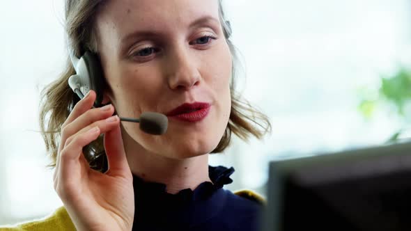 Female customer service executive working in call center