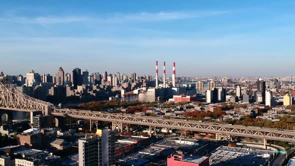 Vehicles Travelling At Queensboro Bridge Passing By The City of Long Island In New York City, USA. -