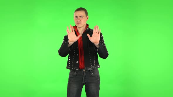 Guy Strictly Gesturing with Hands Shape Meaning Denial Saying NO. Green Screen
