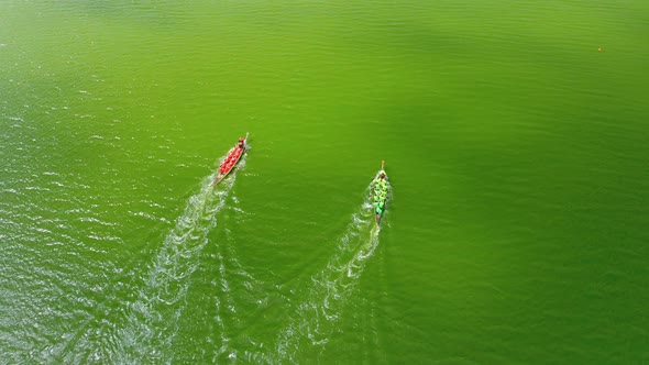 Aerial View of a Rowing Boat Competition One of Which Erroneously Changes Its Trajectory