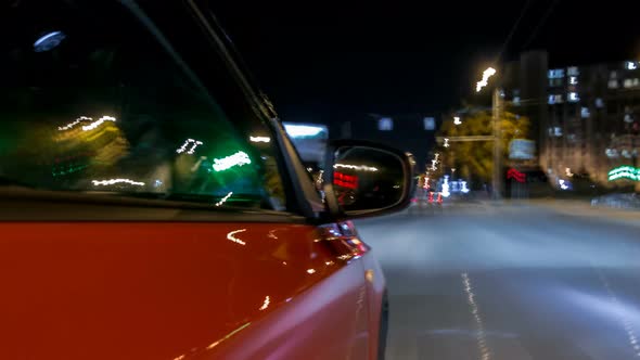 Drivelapse From Side of Car Moving on a Night Avenue in City Timelapse Hyperlapse
