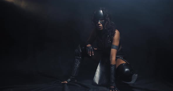 Young Black Woman in Leather Outfit Is Posing As Catwoman Cosplay
