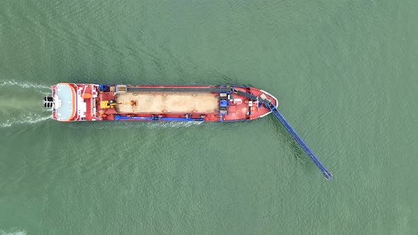 Self Unloading Barge Carrying Cargo At Sea