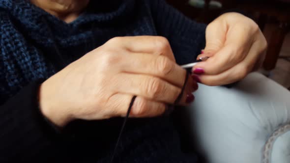 Close up woman hands knitting