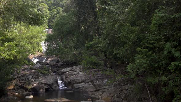 Streams of Water Flow Down Rocky Ledges on Picturesque Waterfall of Sri Lanka