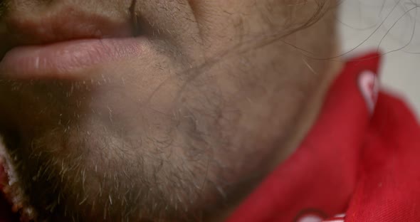 Close up of a cowboy with a straw in his mouth, red bandana, 4k