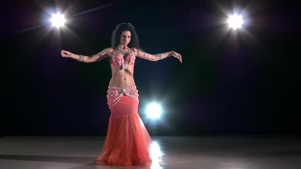 Beautiful Exotic Belly Dancer Woman Dancing on Black, Back Light, Slow Motion