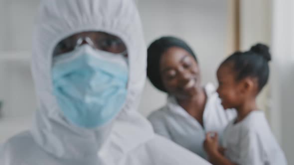 Portrait Medical African Male Doctor Surgeon Looking at Camera Wears Protective Uniform Suit