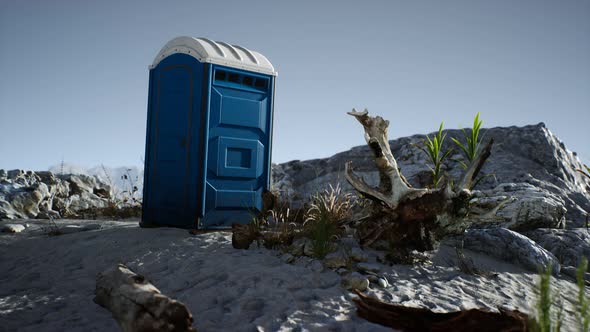 Portable Mobile Toilet in the Beach. Chemical WC Cabin