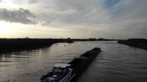 Barge Ship With Cars Sailing Across Oude Maas River Near Zwijndrecht, Netherlands. - aerial