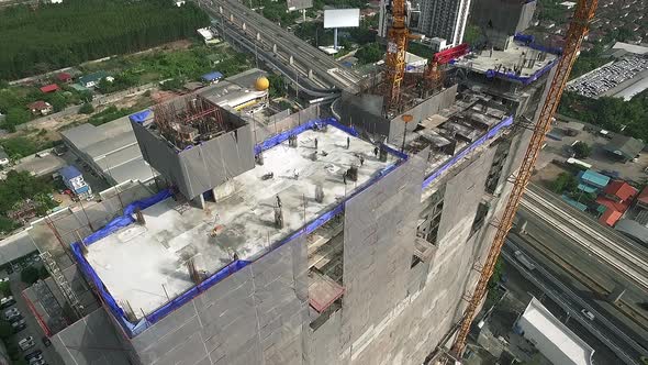 Aerial view of modern high rise building under construction in the busy city centre business distric