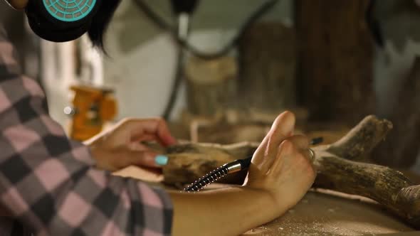 Female Using Power Wood Working Tools Graver Carving While Crafting