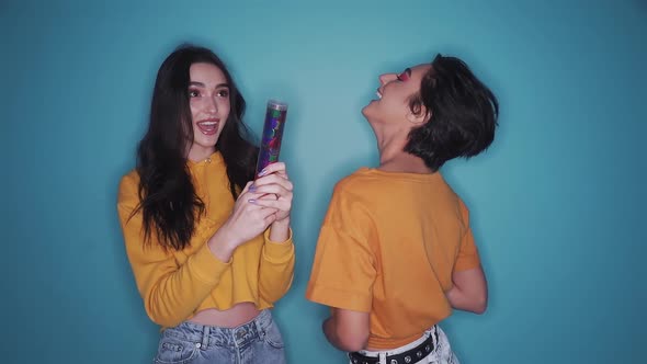 Gen z Girls Celebrating Party Pulling Cracker Dancing and Drinking Champagne