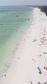 Vertical Video Kitesurfing Near the Shore of Zanzibar Tanzania