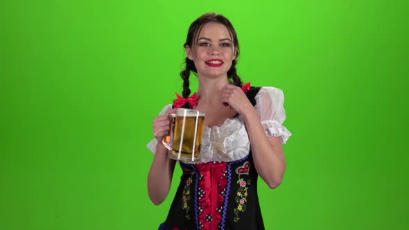 Girl Dancing with a Glass of Beer in His Hand and Showing Thumb Up