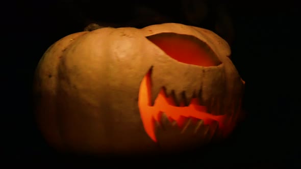 Evil pumpkin on black background