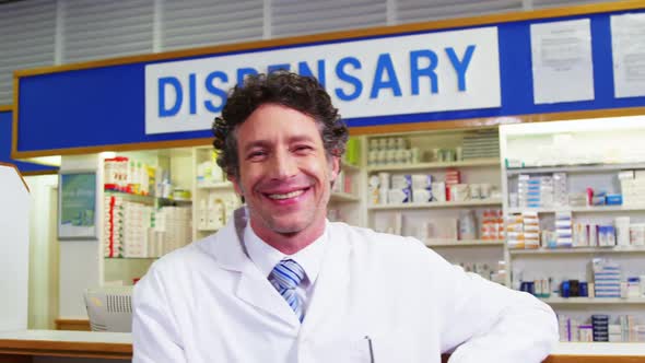 Pharmacist standing at counter