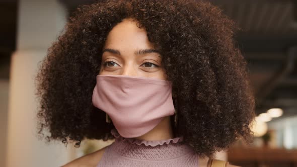 Businesswoman Entering Office Having Temperature Checked With Digital Thermometer During Pandemic