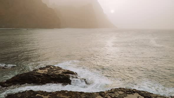 Amazing Silhouette of Huge Cliffs By Sunset in the Dust