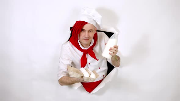 Man with Red Dreadlocks Holds It in His Hand Chicken Eggs and Milk