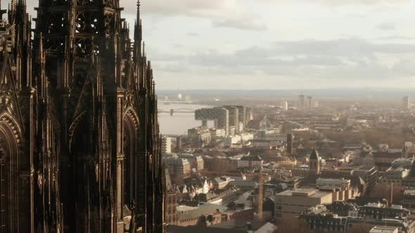 AERIAL: Close Up Circling Around Cologne Cathedral in Beautiful Sunlight 