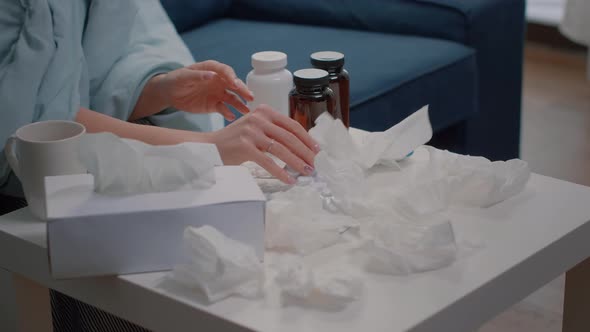 Close Up of Hand Searching for Medical Treatment Against Flu