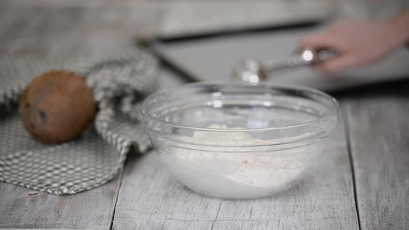 Woman Preparing Cookies at the Kitchen Making Coconut Macaroons