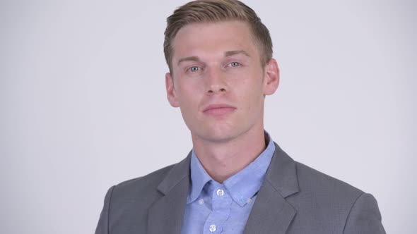 Face of Young Handsome Businessman Wearing Suit