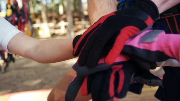 Trainer and kids performing a hand stack 4k