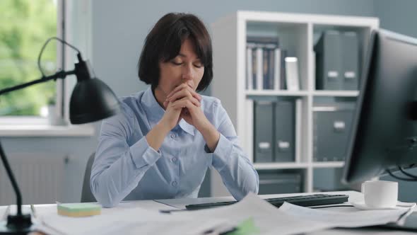Tired Woman Thinking at Office