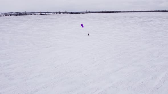 SnowKiting Kitesurfing Sport on the Ice Lake Winter