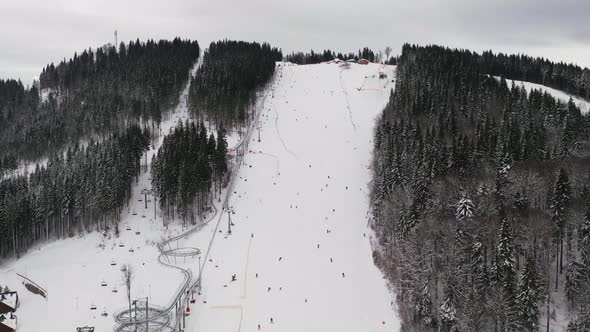 Aerial Hyperlapse View of Skiers Slope on Mountain Slopes Resort