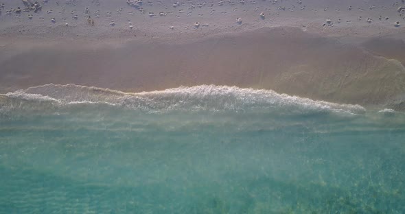 Tropical fly over abstract shot of a summer white paradise sand beach and aqua turquoise water backg