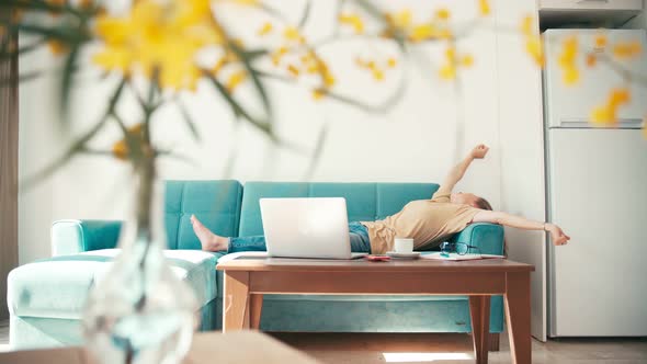 A Young Woman Going Crazy on the Couch While Self-isolation