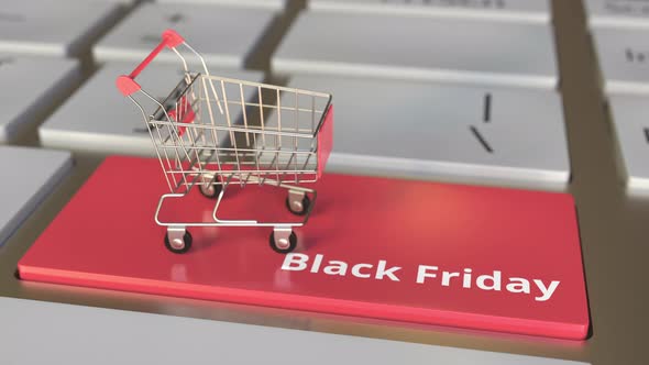 Black Friday Text on Keyboard and Boxes in Small Shopping Cart