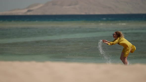 Beach Time in Summer Vacation Woman is Playing with Water and Enjoying Holidays