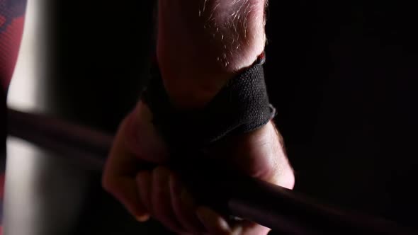 Hand of Strong Sportsman Holding Barbell, Closeup