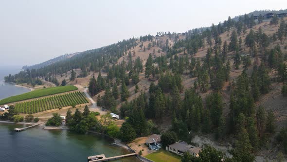 Okanagan lake north of Kelowna, British Columbia on a smoky day during wildfire season of 2021. Wide