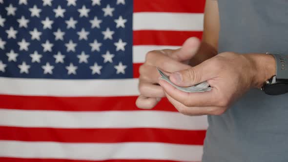 Counting Money Against American Flag