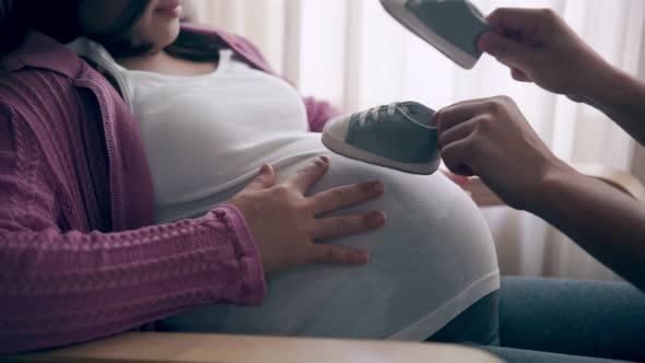 Pregnant Couple Feels Love and Relax at Home