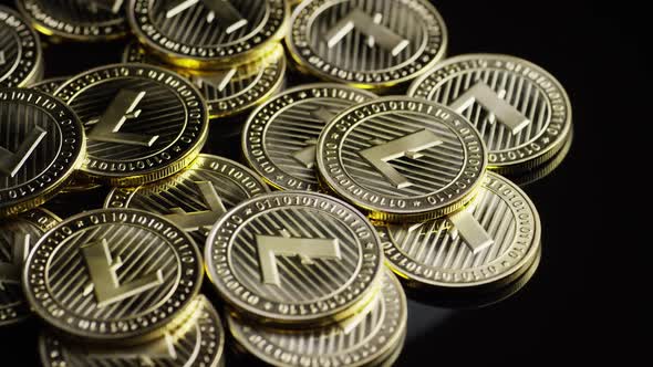 Rotating shot of Bitcoins (digital cryptocurrency) - BITCOIN LITECOIN