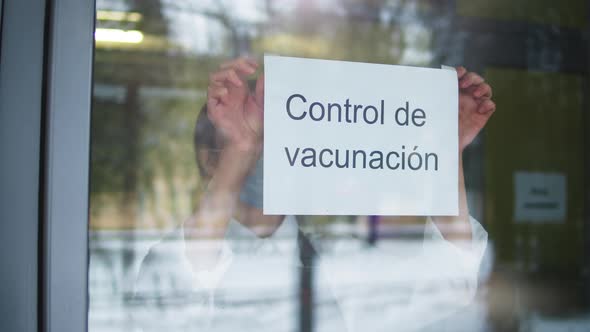 Woman in Mask Putting Up Entry Covid Requirements International Coronavirus Measures Vaccination