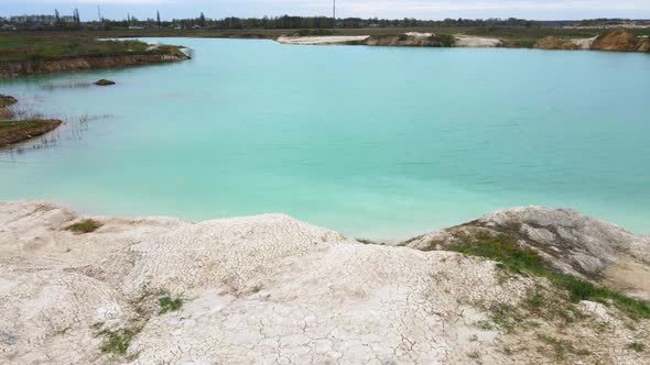 Aerial drone view Amazing industrial landscape, on Emerald lake in a flooded quarry