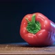 Red Bell Pepper Falls on Brown Wooden Board in Restaurant - VideoHive Item for Sale