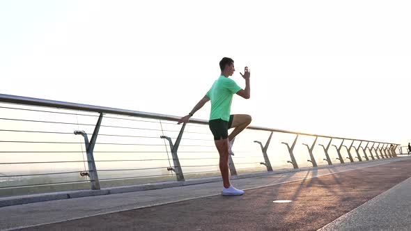 Sporty Guy Trainer Warming Up with Back Lunge Exercise Outdoor Fitness