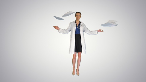 Young Doctor Woman Throwing Paper Documents on Gradient Background