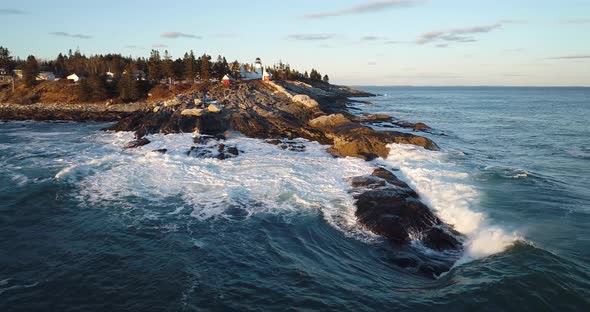 Aerial view of the Curtis island lighthouse Camden Maine USA while the waves hits the rocks